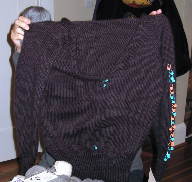Leslie hiding behind her sweater